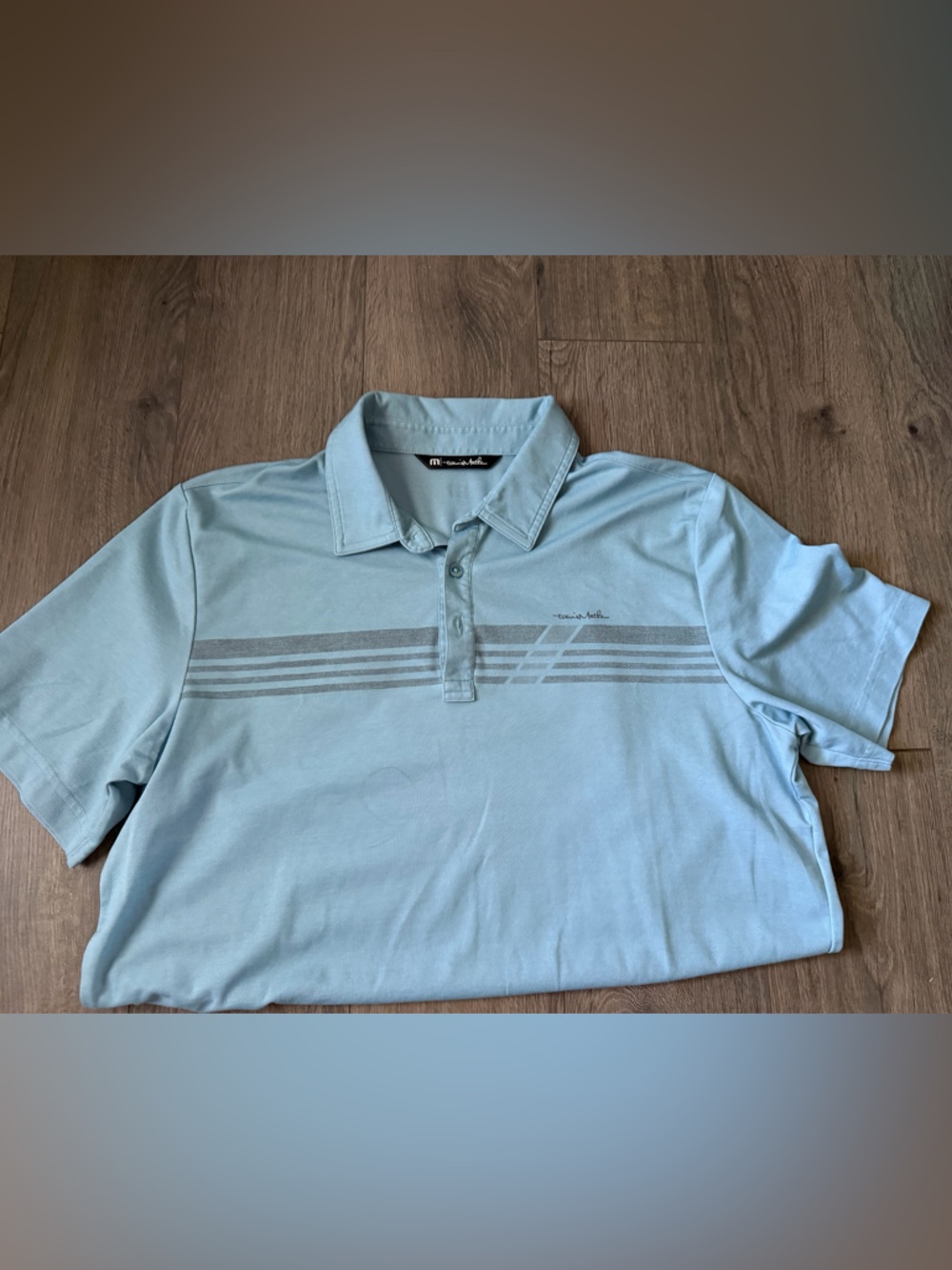 Travis Mathew Light Blue Polo with Gray Stripe Detail